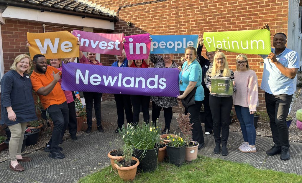 Newlands team celebrating IiP Platinum